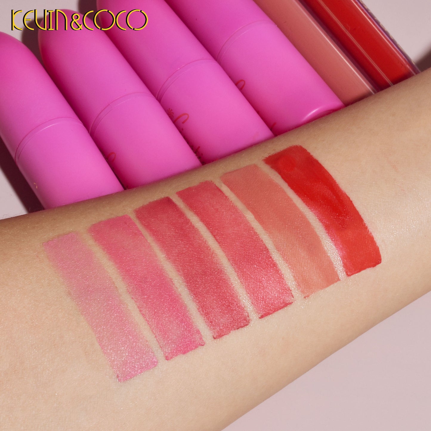 Lipstick swatches on a arm with Kevin & Coco lipsticks in the background