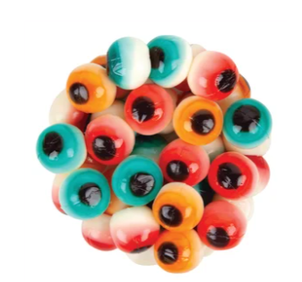 Colorful eye-shaped candies arranged in a circular pattern on a white background