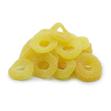 Yellow gummy rings on a white background