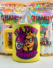 Yellow mug with 'Tea Time with Gringa' design in front of colorful 'Chamoy Gulas' packages.
